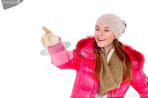 Image of Young woman wearing winter jacket scarf and cap