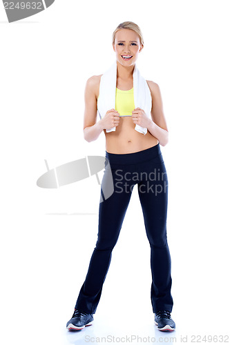 Image of Happy sporty blond woman standing on white