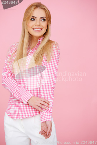 Image of Blond girl in pink, standing full-length