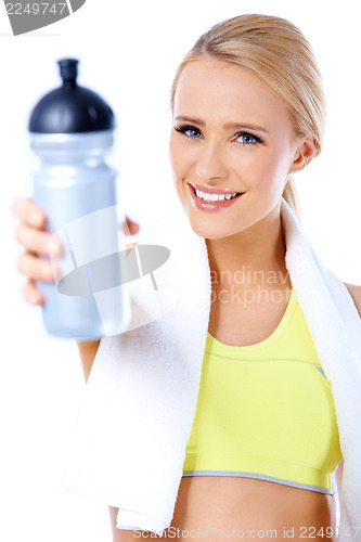 Image of Cute sporty blond woman holding water bottle