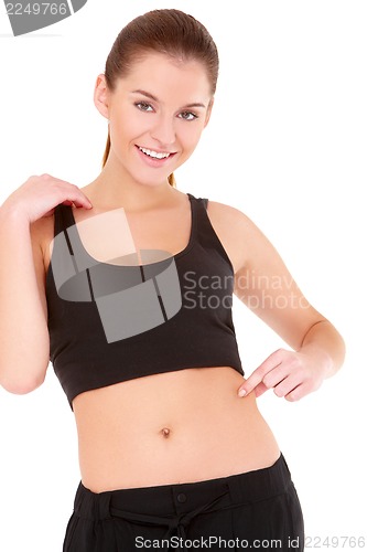 Image of Woman checks the waist fatness on white