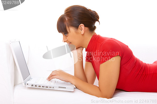 Image of Girl with laptop on couch