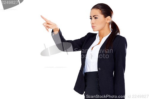 Image of Business woman pointing at empty space