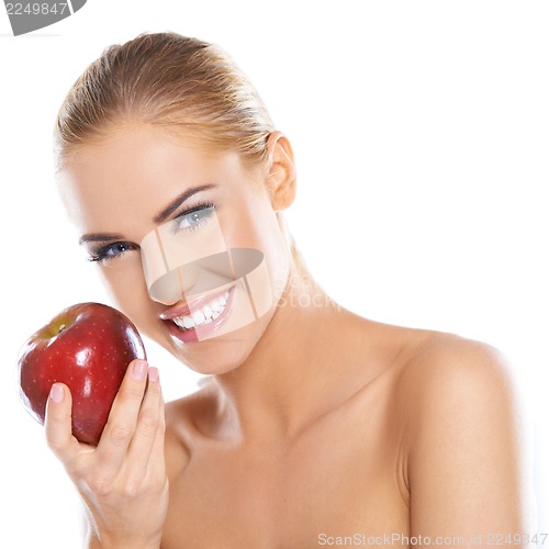 Image of Cute young lady holding red apple
