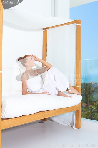 Image of Woman enjoying tropical luxury