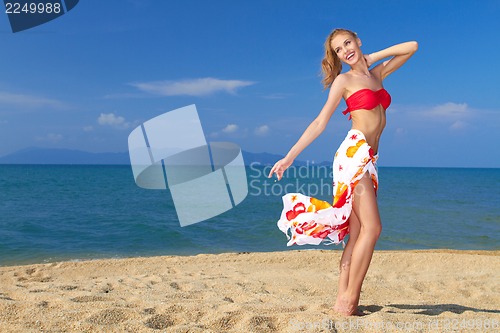 Image of Pretty blonde girl in bikini expressing happiness