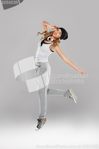 Image of High-spirirted young woman dancing