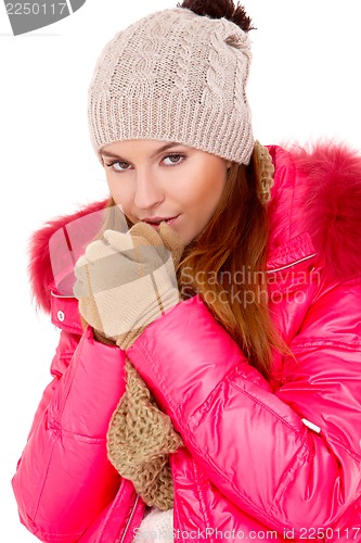 Image of Young woman wearing winter jacket scarf and cap