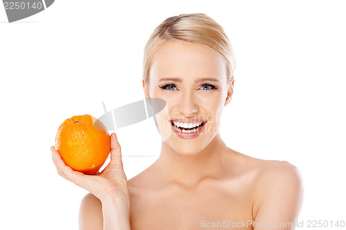 Image of Smiling girl is holding fresh orange