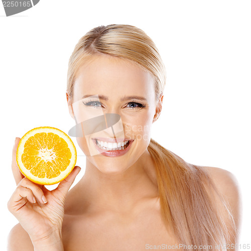 Image of Blond woman with beautiful smile holding orange