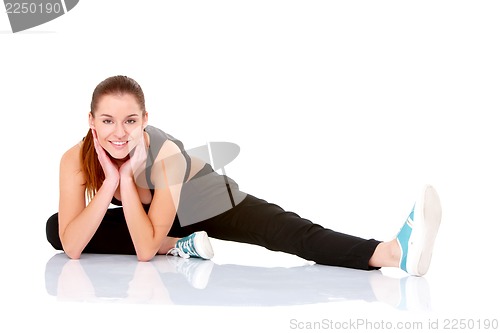 Image of Beautiful fitness woman doing stretching exercise
