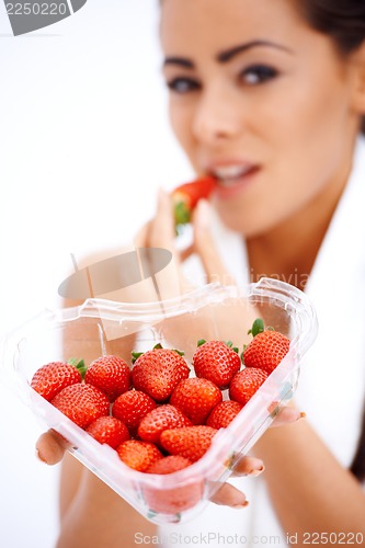 Image of Woman holding heart shaped box of strawberries