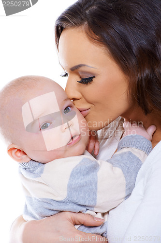 Image of Loving mother kissing her small baby