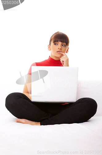 Image of Girl with laptop on couch