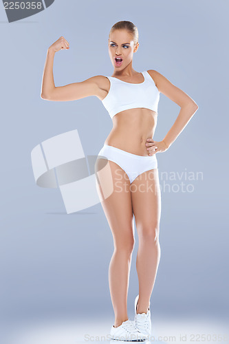 Image of Fun image of a woman displaying her biceps