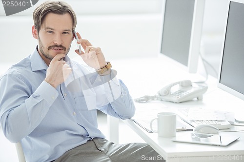 Image of Close up of businessman talking mobile phone