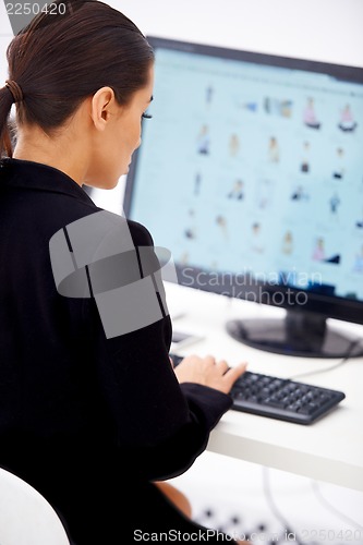 Image of Business woman sitting at her workplace