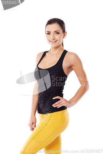 Image of Beautiful sexy woman in yellow gym tights