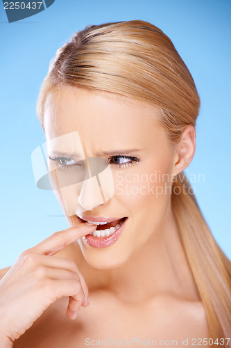 Image of Blond beautiful woman on blue