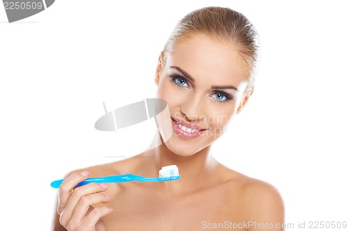 Image of Closeup portrait of a woman brushing her teeth