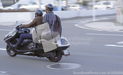 Image of Friends riding a bike