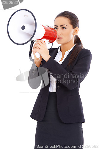 Image of Business woman screaming loudly thru big megaphone