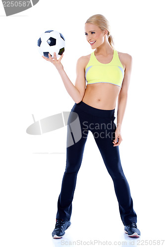 Image of Female football player holding a ball