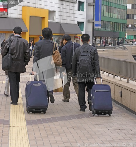 Image of Businessmen travellers group