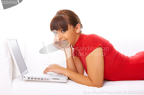 Image of Girl with laptop on couch