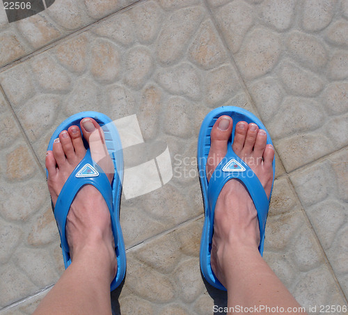 Image of Feet in a pair of flip-flops