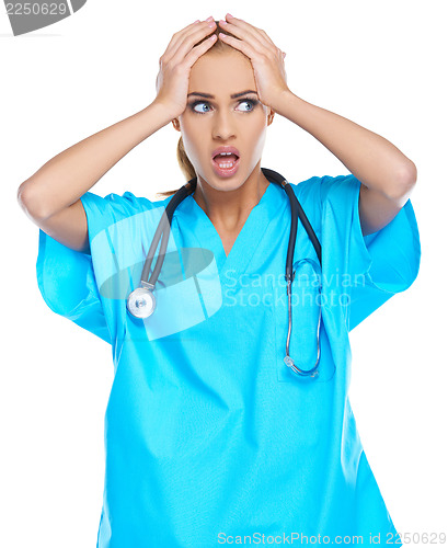 Image of Distressed doctor holding her head