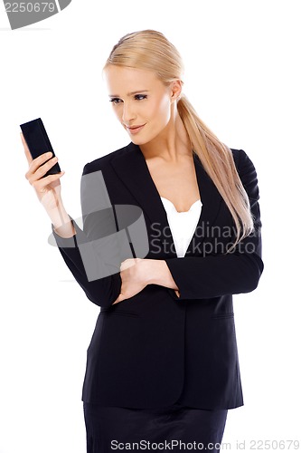 Image of Happy blond business woman using her mobile