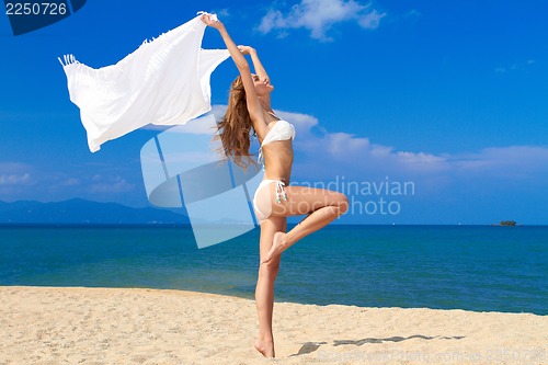 Image of Sexy model playing with white material