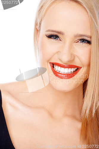 Image of Portrait of smiling blond cute woman with red lipstick