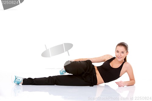 Image of Beautiful fitness woman doing stretching exercise