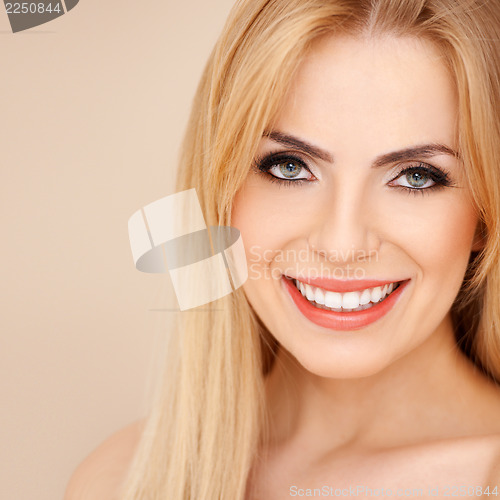 Image of Smiling blond with bare shoulders