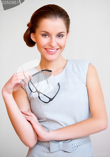 Image of Young attractive business woman with glasses