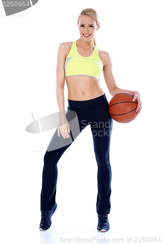 Image of Blond relaxed girl holding basket ball