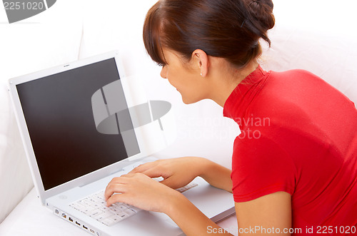 Image of Girl with laptop on couch