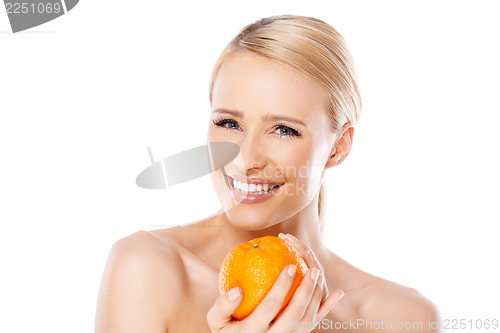 Image of Smiling girl is holding fresh orange