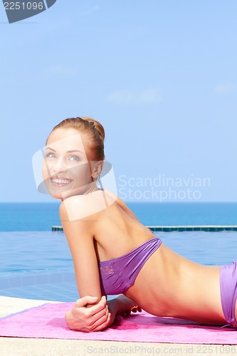 Image of Taking sunbath in bikini