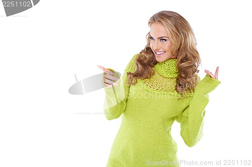 Image of Woman in green warm sweater and white glasses