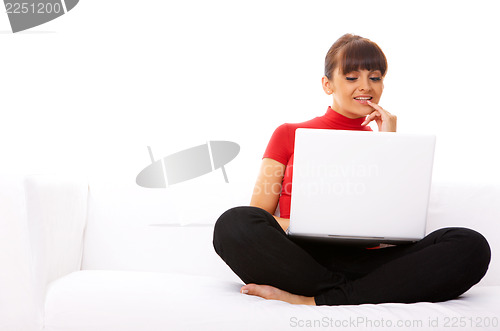 Image of Girl with laptop on couch