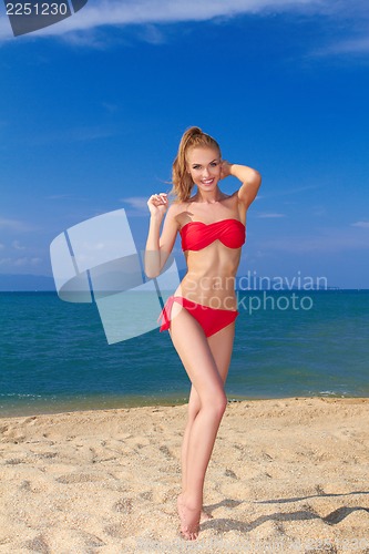 Image of Beautiful female posing in red bikini