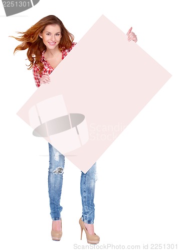 Image of Young woman in casual clothing holding empty board