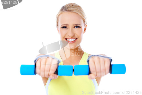 Image of Close up of fit woman while exercise with dumbbells