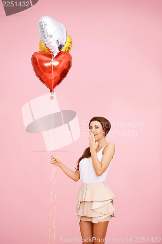 Image of Cute brunette with balloons