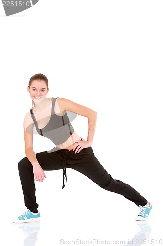 Image of Beautiful fitness woman doing stretching exercise