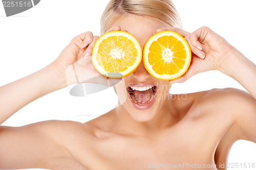 Image of Blond woman making glasses with orange halfs