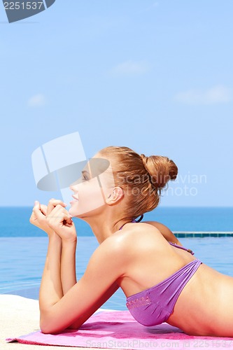 Image of Taking sunbath in bikini